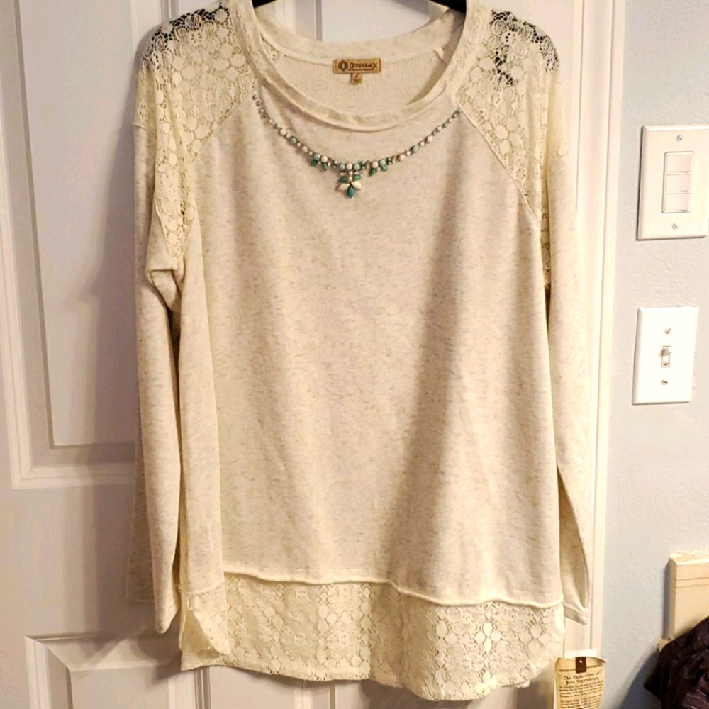 Ladie's long sleeved lace shoulder top